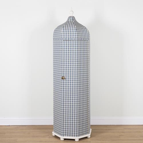 COLEFAX AND FOWLER, THE TENTED WARDROBE; AN UPHOLSTERED OCTAGONAL SINGLE DOOR WARDROBE