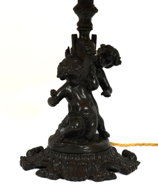 A PAIR OF ROCOCO STYLE BRONZE PATINATED METAL PUTTI TABLE LAMPS (2)