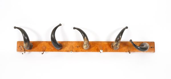 A PAINTED FAUX BURR WOOD AND HORN MOUNTED COAT HOOK