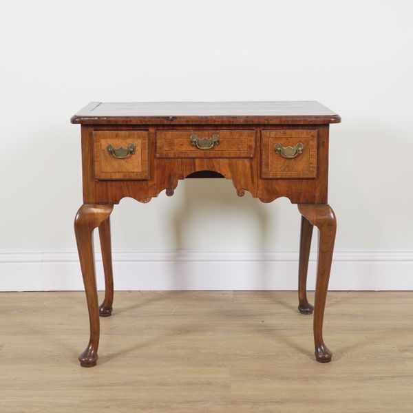 A MID 18TH CENTURY FIGURED WALNUT THREE DRAWER LOW BOY