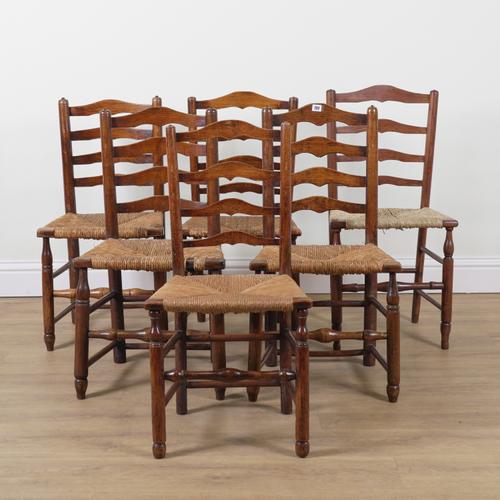 A MATCHED SET OF SIX 19TH CENTURY ASH LADDER BACK DINING CHAIRS (6)