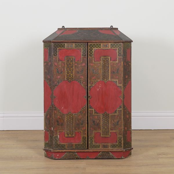 A 19TH CENTURY AND LATER RED CHINOISERIE DECORATED CONTINENTAL CORNER CUPBOARD