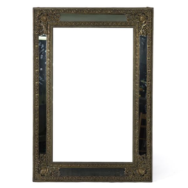 A 19TH CENTURY REPOUSSE BRASS MARGINAL WALL MIRROR