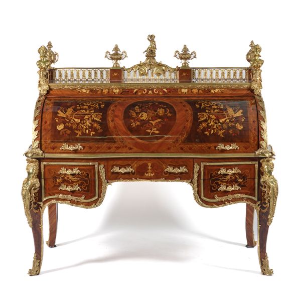 AFTER JEAN HENRI RIESENER, (1734-1806), A GILT METAL MOUNTED FLORAL MARQUETRY INLAID KINGWOOD AND WALNUT CYLINDER BUREAU