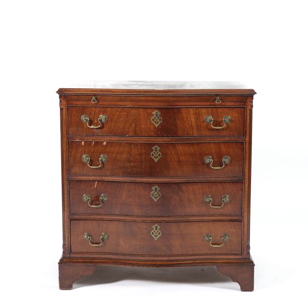 A MAHOGANY SERPENTINE CHEST