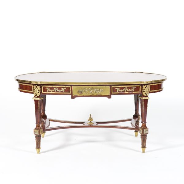 A GILT METAL MOUNTED PARQUETRY INLAID MAHOGANY OVAL COFFEE TABLE