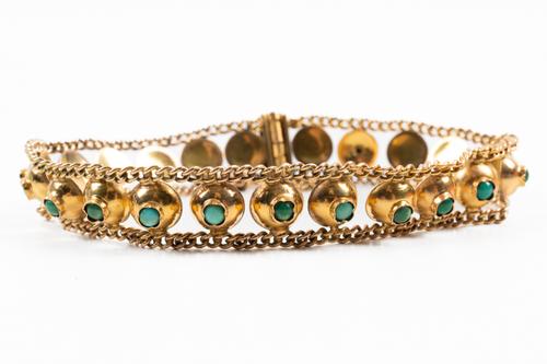 A MIDDLE EASTERN GOLD AND TURQUOISE BRACELET