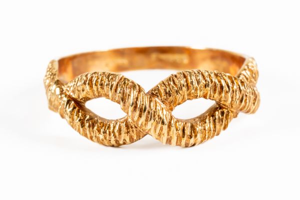 A GOLD INFINITY DESIGN RING