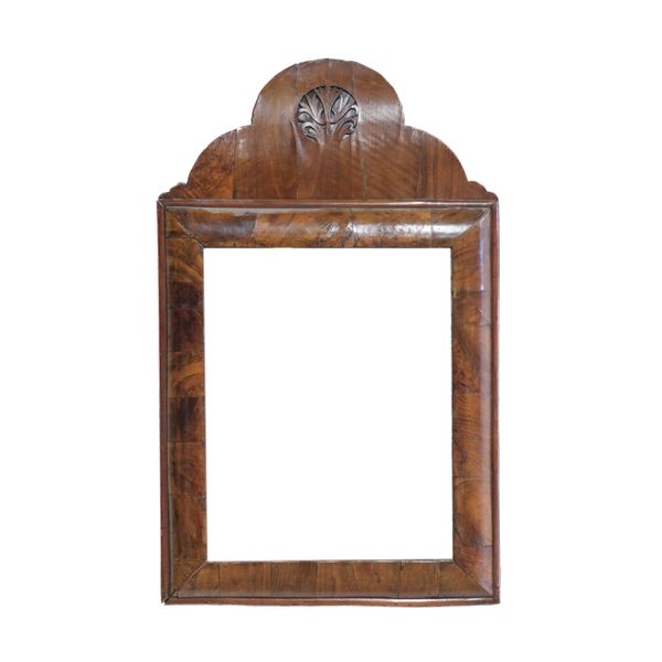 AN EARLY 18TH CENTURY WALNUT CUSHION FRAMED MIRROR