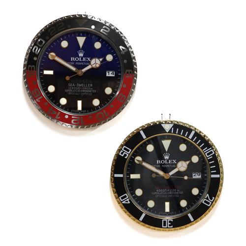 TWO METAL WALL CLOCKS IN THE STYLE OF ROLEX SEA DWELLER WATCHES (2)