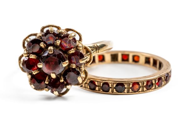 TWO 9CT GOLD AND GARNET RINGS (2)