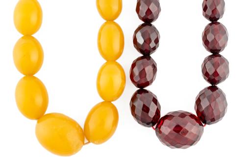 TWO VARICOLOURED AMBER STYLE NECKLACES (2)