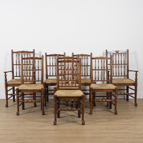 A SET OF EIGHT OAK, ASH AND BEECH LANCASHIRE SPINDLE BACK DINING CHAIRS (8)