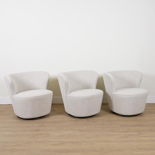 ROBERT LANGFORD, BATTERSEA; A SET OF THREE UPHOLSTERED SWIVEL TUB BACK ARMCHAIRS (3)