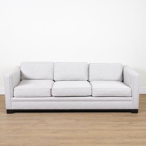 ROBERT LANGFORD, FORD; AN UPHOLSTERED THREE SEAT SOFA