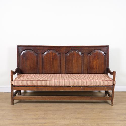 AN 18TH CENTURY AND LATER OAK PANELLED BACK OPEN ARM SETTLE