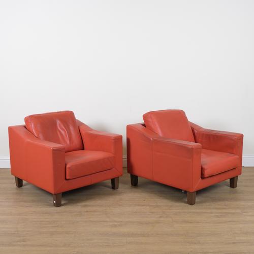 LEOLUX; A PAIR OF 20TH CENTURY ORANGE LEATHER UPHOLSTERED SQUARE BACK EASY ARMCHAIRS (2)