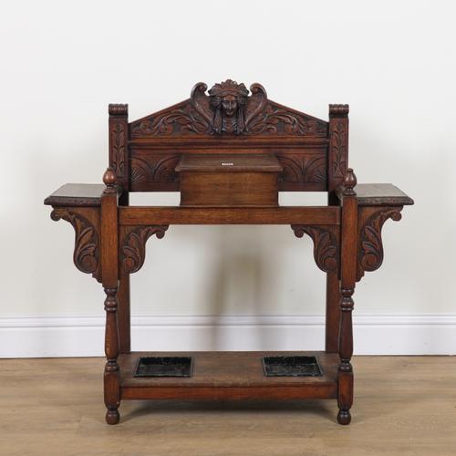 AN EARLY 20TH CENTURY CARVED OAK HALL STAND