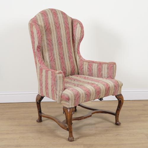 AN EARLY 18TH CENTURY WALNUT FRAMED WINGBACK ARMCHAIR