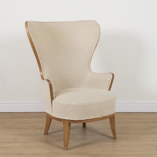 REVELAGORA; AN OAK FRAMED SHAPED BACK EASY ARMCHAIR