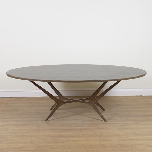 MARC DE BERNY; AN OVAL DINING TABLE