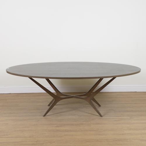 MARC DE BERNY; AN OVAL DINING TABLE