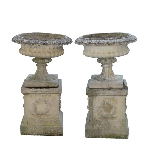 A PAIR OF RECONSTITUTED STONE JARDINIERES (2)