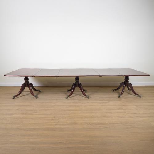 A REGENCY MAHOGANY TRIPLE PILLAR DINING TABLE