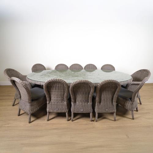 BRIDGMAN; A RATTAN OVAL GARDEN TABLE (13)