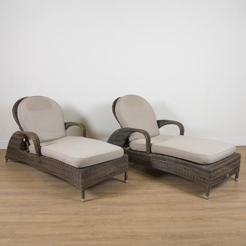 BRIDGMAN; A PAIR OF RATTAN OPEN ARM GARDEN LOUNGERS (2)