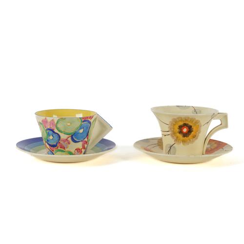 A CLARICE CLIFF `BLUE CHINTZ' PATTERN CONICAL TEA CUP AND SAUCER (4)