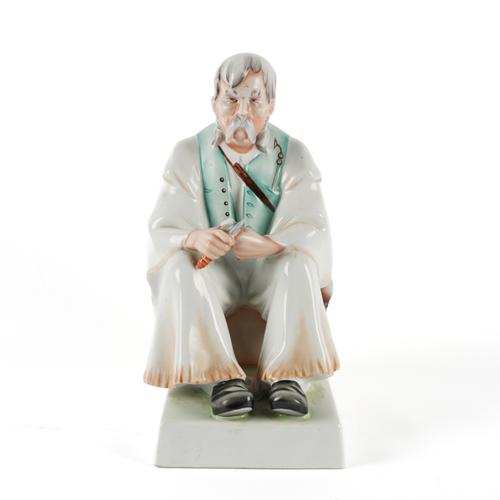 A HUNGARIAN ZSOLNAY 'WOODCUTTER' FIGURE