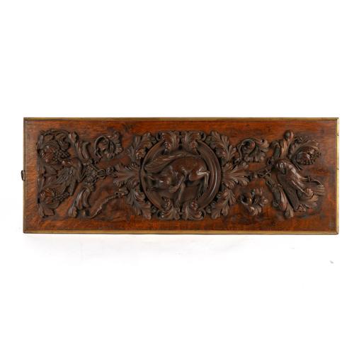 A VICTORIAN OAK PANEL WITH RELIEF CARVING DEPICTING A SQUIRREL