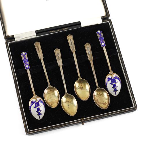 A SET OF SIX SILVER AND ENAMELLED COFFEE SPOONS
