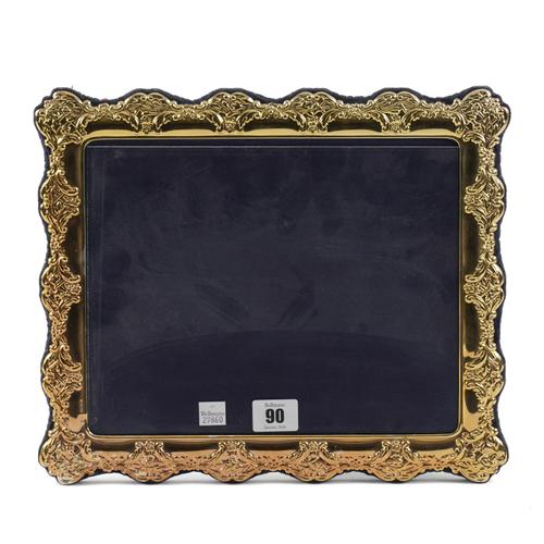 A SILVER GILT SHAPED RECTANGULAR PHOTOGRAPH FRAME,,