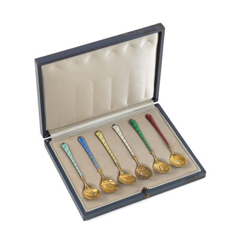 A SET OF SIX SILVER GILT AND VARICOLOURED ENAMEL COFFEE SPOONS