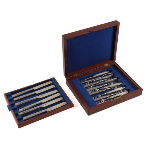 A PART SET OF SILVER DESSERT OR FRUIT KNIVES AND FORKS