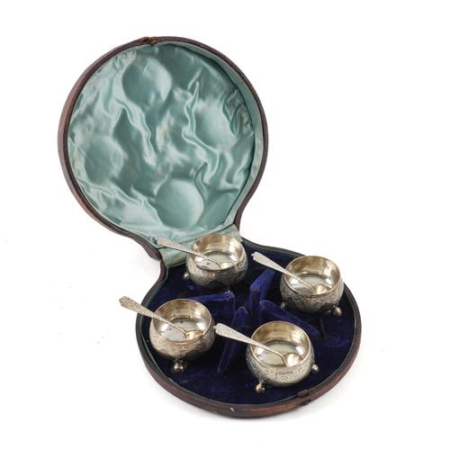 A SET OF FOUR VICTORIAN SILVER SALTS AND FOUR SALT SPOONS