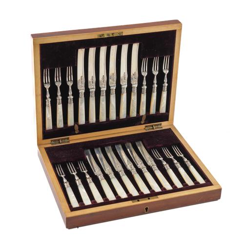 A SET OF TWELVE PAIRS OF SILVER DESSERT OR FRUIT KNIVES AND FORKS