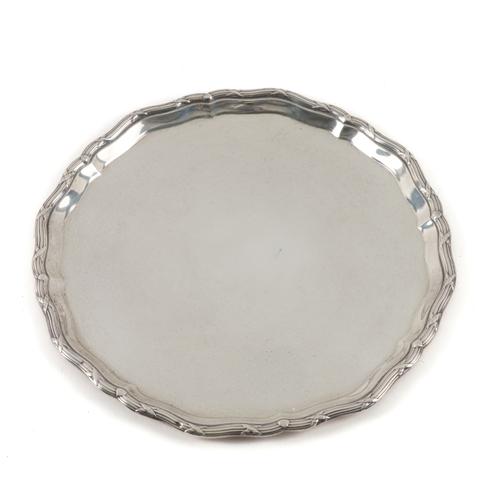 A SILVER SHAPED CIRCULAR SALVER