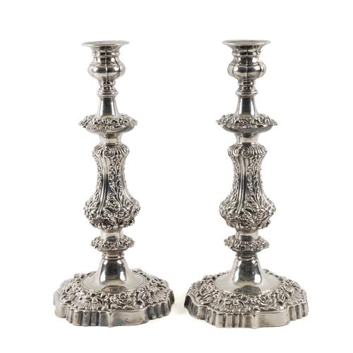 A PAIR OF PLATED TABLE CANDLESTICKS