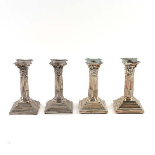 A PAIR OF SILVER CANDLESTICKS AND A PAIR OF PLATED CANDLESTICKS (4)