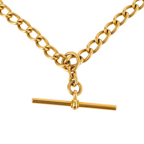 A GOLD ALBERT CHAIN WITH T BAR