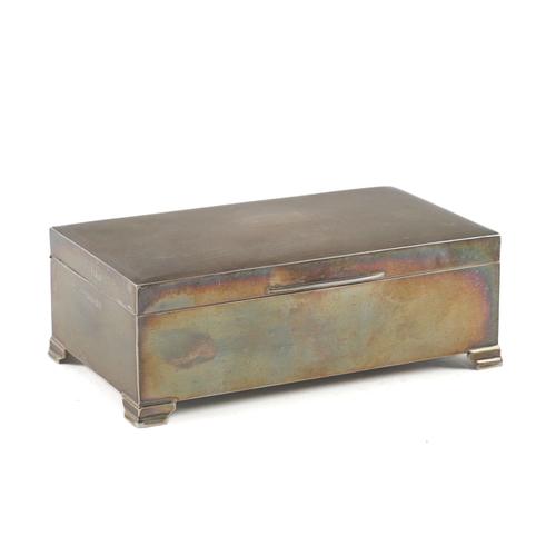 A SILVER RECTANGULAR TABLE CIGARETTE BOX