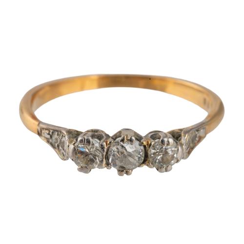 A GOLD AND DIAMOND THREE STONE RING