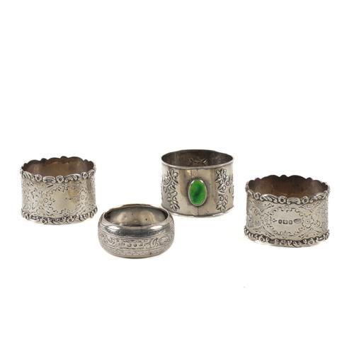 FOUR SILVER NAPKIN RINGS (4)