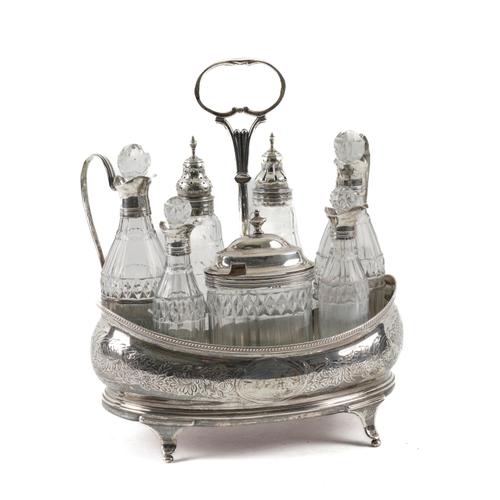 A GEORGE III SILVER SEVEN BOTTLE CRUET STAND