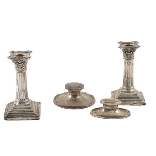 TWO SILVER MOUNTED INKSTANDS AND A PAIR OF SILVER TABLE CANDLESTICKS (4)