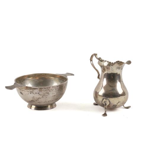 A SILVER TWIN HANDLED BOWL AND A SILVER CREAM JUG (2)