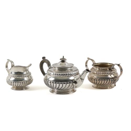 A SILVER THREE PIECE TEA SET